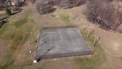 Drone-shot-of-empty-tennis-court-in-public-park