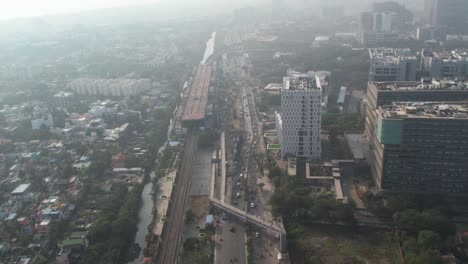 Sunrise-aerial-shot-of-highway-in-Chennai-city-filled-with-misty-fog