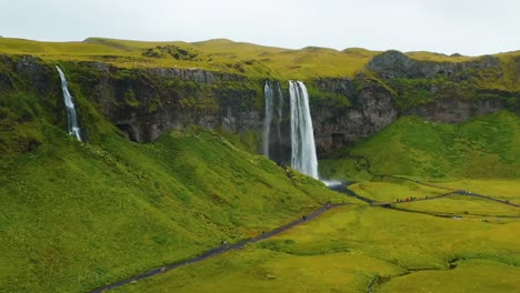 4K-drone,-aerial-cinematic-shots-of-Iceland's-stunning-greenery-landscape-with-cascading-waterfalls