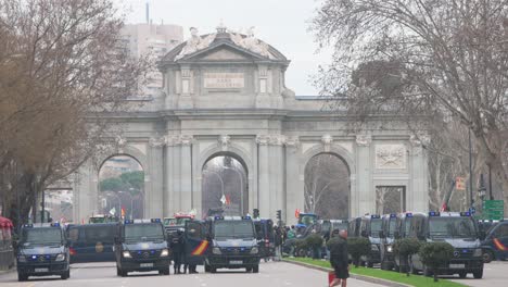 Police-vans-are-seen-at-Plaza-de-la-Independencia,-also-known-as-Puerta-de-Alcalá,-during-farmers-and-agricultural-unions-protest-against-unfair-competition,-agricultural-and-government-policies