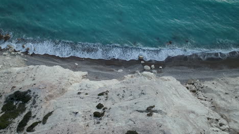Rocky-white-sand-beach-in-aerial-top-down-view