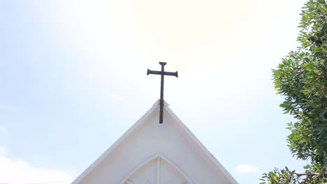 Scenic-view-of-religious-Roman-Catholic-crucifix-symbol-on-chapel-in-Santa-Cruz-cemetery-in-capital-city-of-East-Timor,-Southeast-Asia