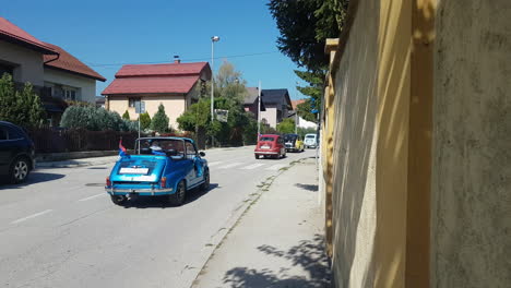 Fiat-500-Oldtimers-Parade,-Vintage-Small-Italian-Cars-on-Street-in-Uzice,-Serbia