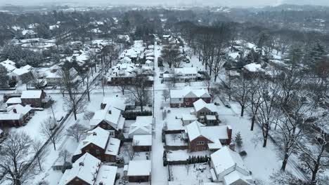Aerial-reveal-of-a-suburban-landscape-with-snow