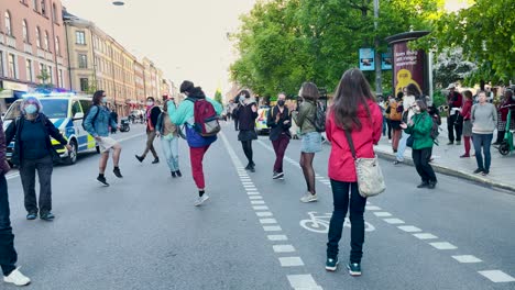 Slomo-of-dancing-climate-protesters-at-peaceful-demonstration,-Sweden