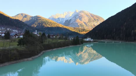 View-reflection-of-snowy-mountain-in-a-turquoise-lake