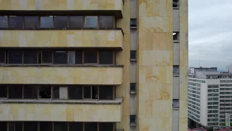 As-the-drone-gracefully-takes-flight,-it-unveils-a-mesmerizing-vista-of-the-Nemqueteba-Building,-Throttle-up