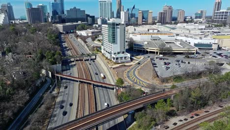 Aerial-approaching-shot-of-traffic-on-highway-and-flight-over-Hyatt-Centric-Buckhead-Atlanta