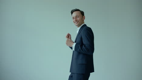 Handsome-Caucasian-Man-In-Suit-Happy-Motivated-Smiling-and-Looking-Aside,-Studio-Shot