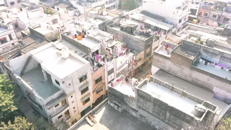 AERIAL-DRONE-VIEW-The-drone-camera-shows-many-residential-buildings-around-and-many-landmarks-around-and-Jai-Shri-Ram's-rangoli-is-visible-on-the-road