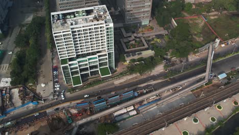 Aerial-shot-of-metro-and-road-contruction-near-corporate-buildings-in-India