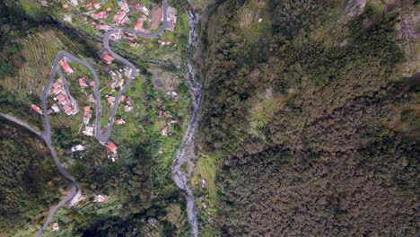 Hover-above-quaint-villages-nestled-amidst-Madeira's-picturesque-countryside,-each-with-its-own-story-to-tell