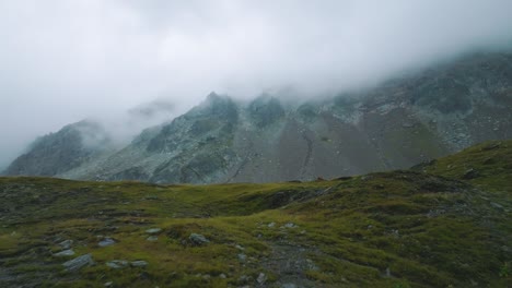 Tracking-in-on-misterious-misty-mount,-French-Alps