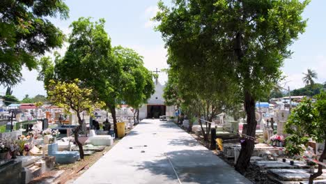 View-of-pathway-leading-to-chapel-under-renovation-in-historic-site-of-Santa-Cruz-cemetery-in-capital-city-of-East-Timor,-Southeast-Asia