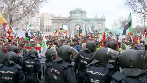 Police-officers-intervene-as-Spanish-farmers-and-agricultural-unions-gather-at-Plaza-de-la-Independencia-to-protest-against-unfair-competition,-agricultural-and-government-policies