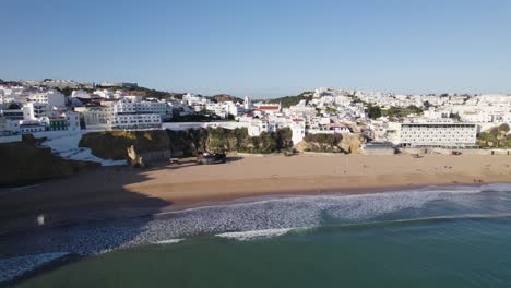 Scenic-town-by-the-sea,-rocky-cliffs,-Albufeira-in-Portugal,-drone-establisher