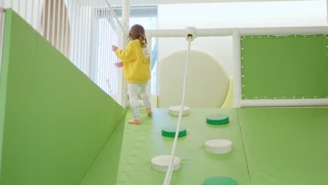 Adorable-Toddler-Girl-Playing-Inside-Indoor-Playground
