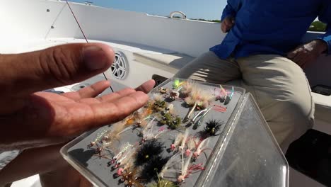 Wide-angle-closeup-view-of-fishing-guide-explaining-and-talking-about-various-types-of-flies