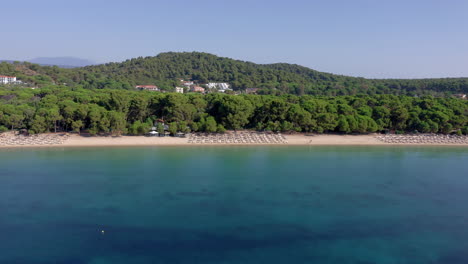Aerial:-Koukounaries-sandy-beach-with-turquoise-crystal-clear-water-in-Skiathos-island,-Greece