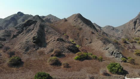 steep-rugged-mountains-and-turquoise-water-at-The-Pink-Beach-On-Padar-Island-in-Komodo-National-Park,-Indonesia