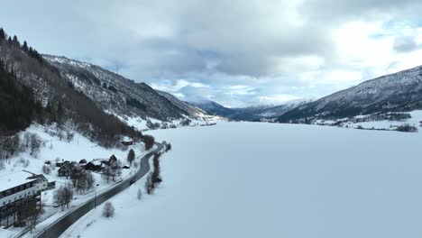 Oppheimsvatnet-lake-Voss-Norway,-rising-Winter-aerial