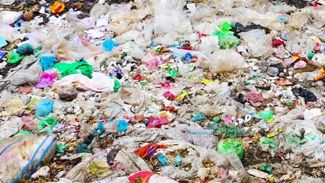 Closeup-shot-of-plastic-wastes-piled-up-and-spread-all-over-ground