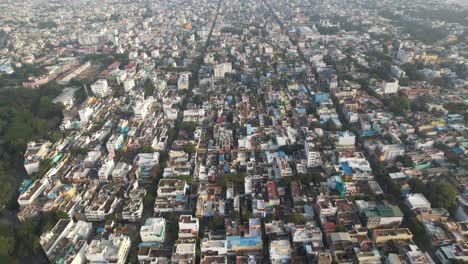 Aerial-Drone-Shot-of-Crowded-Buildings-In-Indian-City-During-Sunset