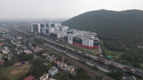 Aerial-shot-of-corporate-company-buildings-near-a-highway-road-in-Indian-city-chennai