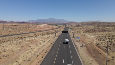 Aerial-View-of-Traffic-on-Veterans-Highway-in-Desert-Landscape-of-Utah-USA