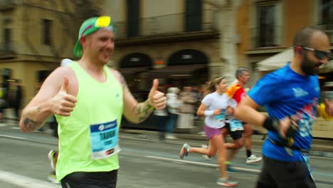 Barcelona-Marathon-2024-Uniting-People-in-Health,-Fitness,-and-Achievement-near-Sagrada-Familia