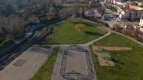 Aerial-establishing-shot-of-a-small-village-with-a-playpark-near-Avignon