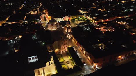 Aerial-Orbit-Over-the-Facade-of-the-Templo-de-San-Francisco-de-Asis-in-San-Miguel-de-Allende-at-Night