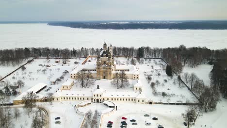 Aerial-view-of-the-Pazaislis-monastery-and-the-Church-of-the-Visitation-in-Kaunas,-Lithuania-in-winter,-snowy-landscape,-Italian-Baroque-architecture