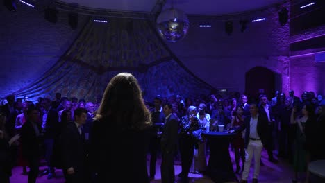 Slow-motion-shot-of-a-business-woman-giving-a-speech-at-a-business-gala