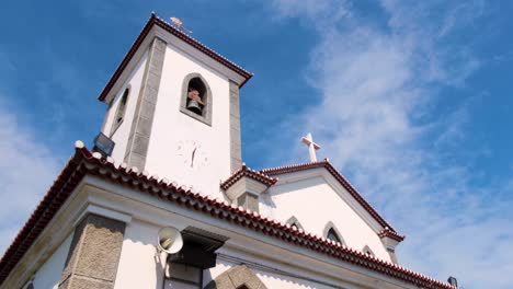 Looking-up-at-bell-tower-of-Church-of-Saint-Anthony-of-Motael,-oldest-Roman-Catholic-church-in-Timor-Leste,-capital-city-of-East-Timor,-Southeast-Asia