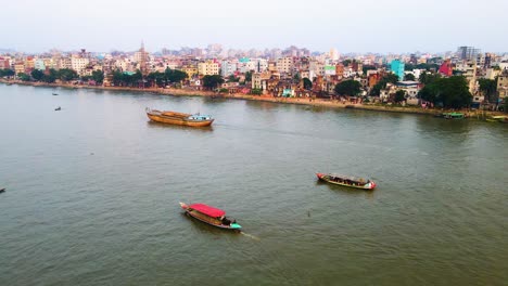 Boat-traffic-on-Buriganga-river,-cargo-passenger-ship-Dhaka-Bangladesh