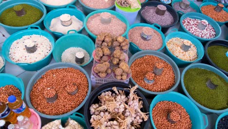 A-colorful-variety-of-dried-beans,-corn-and-rice-at-Taibesi-fruit-and-vegetable-market-in-the-capital-city-of-East-Timor,-Southeast-Asia