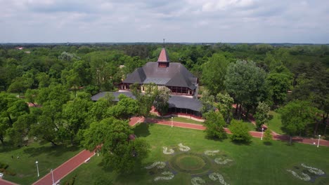 Drone-Shot-of-Grand-Terrace-Building-and-Park-at-Palic-Lake,-Serbia