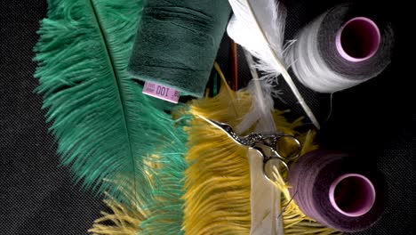thread-on-spool-bobbin-scissors-tailor-feather-tailor-high-angle-slide