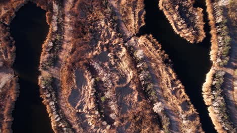 Top-Down-Aerial-View-of-Wetlands-of-Sewage-Water-Treatment-in-Desert-Landscape,-High-Angle-Drone-Shot