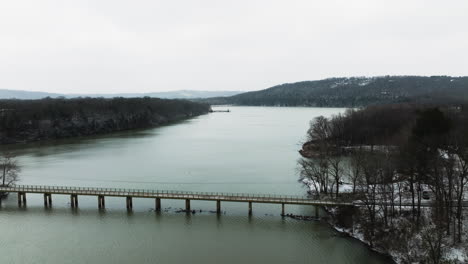 Aerial-View-Of-Bridge-Over-Lake-Sequoyah-During-Winter-In-Arkansas,-USA---Drone-Shot