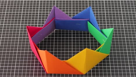 Modular-origami-crown-with-rainbow-colors,-crafted-with-precision-and-creativity