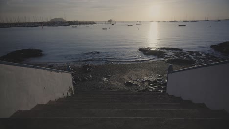 Staircase-leading-to-beach-at-sunrise