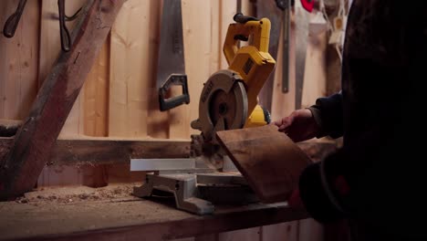 The-Man-is-Preparing-to-Use-a-Circular-Saw-to-Cut-a-Wooden-Plank-for-the-Construction-of-a-DIY-Hot-Tub---Close-Up