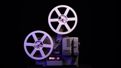 Vintage-Rus-Movie-Cinema-Projector,-8mm-Home-Film-Theater,-Close-Up-on-Black-Background,-Full-Frame-4k