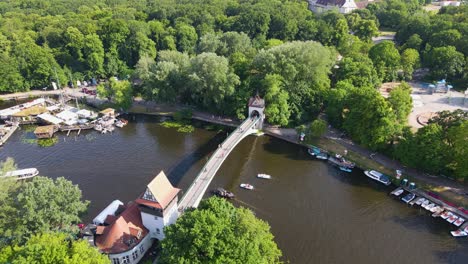 xplore-the-scenic-beauty-of-Berlin's-parks-and-waterways-from-a-bird's-eye-view,-as-the-drone-glides-gracefully-over-the-Spree,-revealing-tranquil-greenery-and-sparkling-waterways