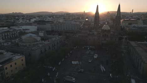 Aerial-of-Guadalajara-main-cathedral-old-town-city-square-at-sunset