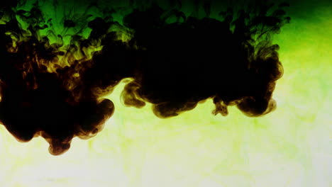 green-dye-dilutes-in-water-tank,-creating-epic-liquid-art