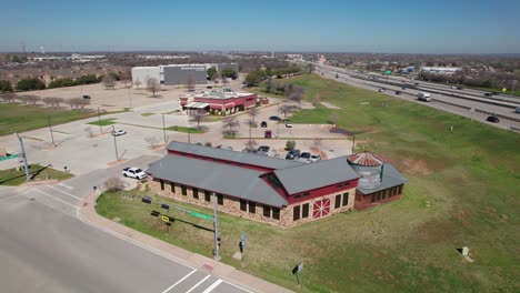 Aerial-footage-of-the-Elm-Fork-Taphouse-in-Hickory-Creek,-Texas