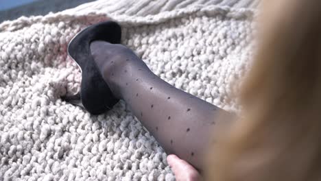 woman-leg-with-high-heel-shoe-in-polka-dot-tight-close-up-slow-motion